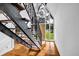 Entryway with hardwood floors, staircase with iron railings, and A frame picture window at 4274 Smithsonia Ct, Tucker, GA 30084