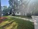 Charming home featuring A-frame design, white painted brick and a manicured front yard at 4274 Smithsonia Ct, Tucker, GA 30084