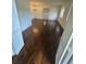 Living room with hardwood floors and a glimpse of other living spaces at 4274 Smithsonia Ct, Tucker, GA 30084