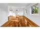 Bright living room with hardwood floors, a chandelier, and natural light from large windows at 4274 Smithsonia Ct, Tucker, GA 30084