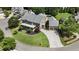 Beautiful aerial view of large luxury home with manicured lawn, driveway, and mature trees at 4830 Westgate Dr, Cumming, GA 30040