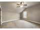 Serene bedroom featuring carpet floors, neutral walls, natural light and a ceiling fan at 4830 Westgate Dr, Cumming, GA 30040