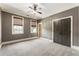 Neutral bedroom with carpet, large windows, and ample closet space at 4830 Westgate Dr, Cumming, GA 30040