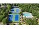 Aerial view of tennis courts and a community pool, perfect for recreation and relaxation at 4830 Westgate Dr, Cumming, GA 30040