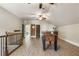 Large game room with foosball table, wet bar, and multiple ceiling fans for added comfort and fun at 4830 Westgate Dr, Cumming, GA 30040