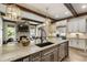 Open-concept kitchen with granite island and an adjacent Gathering room, great for entertaining at 4830 Westgate Dr, Cumming, GA 30040