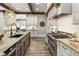 Gourmet kitchen boasting stainless steel appliances, granite countertops, and a center island at 4830 Westgate Dr, Cumming, GA 30040