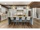 Bright and airy kitchen featuring a large island, modern appliances, and stylish pendant lighting at 4830 Westgate Dr, Cumming, GA 30040