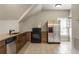 Well-equipped kitchenette featuring stainless steel appliances, granite countertops, and ample natural light at 4830 Westgate Dr, Cumming, GA 30040