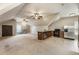 Large living area with a kitchenette including stainless steel appliances, carpet and tile flooring, and great natural light at 4830 Westgate Dr, Cumming, GA 30040