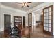 Inviting home office with hardwood floors, glass doors, and ample space for productivity at 4830 Westgate Dr, Cumming, GA 30040
