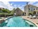 Backyard oasis featuring a gorgeous pool, waterfall, and lounge chairs on the patio at 4830 Westgate Dr, Cumming, GA 30040