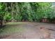 Wide shot of the large backyard with a wood privacy fence at 1227 Epworth Sw St, Atlanta, GA 30310