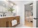 Bathroom showcasing double vanity with modern fixtures, tile backsplash, and natural lighting at 1227 Epworth Sw St, Atlanta, GA 30310