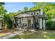 Charming home with a cozy front porch, stone foundation and a manicured lawn at 1227 Epworth Sw St, Atlanta, GA 30310