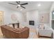 Modern living room showcases a fireplace with white marble, and updated light fixtures at 1227 Epworth Sw St, Atlanta, GA 30310