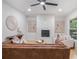 Open-concept living room with a fireplace, stylish furniture, and modern accents at 1227 Epworth Sw St, Atlanta, GA 30310
