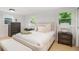 Cozy main bedroom with a plush bed, neutral tones, and soft textures at 1227 Epworth Sw St, Atlanta, GA 30310