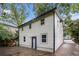 View of home's rear featuring vinyl siding and a full-length driveway at 1227 Epworth Sw St, Atlanta, GA 30310