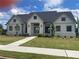 Beautiful single-story home with white siding, black framed windows, and well-maintained lawn at 918 Keystone Dr, Woodstock, GA 30188