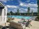 Relaxing community pool area with comfortable seating, umbrellas, and serene atmosphere at 918 Keystone Dr, Woodstock, GA 30188