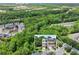 Aerial view of townhome community with lush green surroundings and close proximity to the Mall of Georgia at 2138 Mill Garden Run, Buford, GA 30519