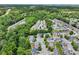 Beautiful aerial view of a residential neighborhood with lush greenery and well-maintained streets at 2138 Mill Garden Run, Buford, GA 30519