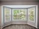 Bright carpeted nook with a scenic bay window for natural light and relaxing views at 2138 Mill Garden Run, Buford, GA 30519