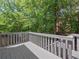 Outdoor deck overlooking wooded backyard, perfect for relaxation and entertainment at 2138 Mill Garden Run, Buford, GA 30519