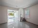 Spacious garage with painted floor, access door to the backyard, window and an open door to the front at 2138 Mill Garden Run, Buford, GA 30519