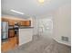 Modern kitchen view with stainless appliances and an open layout to the living area at 2138 Mill Garden Run, Buford, GA 30519
