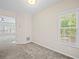 Bright room with view to the living room, staircase, and an exterior window at 2138 Mill Garden Run, Buford, GA 30519
