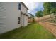 Exterior view of home showcasing the backyard, landscaping, and patio area at 2428 Mills Bnd, Decatur, GA 30034