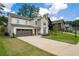 Attractive two-story home featuring a two-car garage, well-kept lawn, and neutral color scheme at 2428 Mills Bnd, Decatur, GA 30034