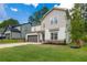 Beautiful two-story home with a two-car garage, stone accents, and manicured landscaping at 2428 Mills Bnd, Decatur, GA 30034