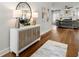 Bright foyer with hardwood floors, modern console table, and stylish decor accents at 2428 Mills Bnd, Decatur, GA 30034