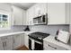 Bright kitchen with stainless steel appliances, subway tile backsplash, and quartz countertops at 2428 Mills Bnd, Decatur, GA 30034