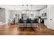 Eat-in kitchen with stainless steel appliances, kitchen island, and modern light fixtures at 2428 Mills Bnd, Decatur, GA 30034