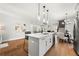 Modern kitchen boasts an island with bar seating and stainless steel appliances at 2428 Mills Bnd, Decatur, GA 30034
