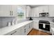 Bright kitchen with stainless appliances, quartz countertops, and ample cabinet space at 2428 Mills Bnd, Decatur, GA 30034
