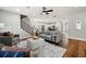 Inviting living room featuring open layout, hardwood floors, and staircase with iron railing at 2428 Mills Bnd, Decatur, GA 30034