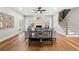 Open concept living room with hardwood floors, fireplace, and staircase with iron railing at 2428 Mills Bnd, Decatur, GA 30034