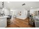 Open concept living area with hardwood floors, modern decor, and seamless flow to kitchen at 2428 Mills Bnd, Decatur, GA 30034