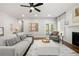 Comfortable living room featuring a decorative fireplace and access to the backyard through french doors at 2428 Mills Bnd, Decatur, GA 30034