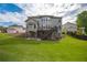 Large backyard view featuring a deck, a neutral paint color, and lush green grass at 3825 Valleyway Rd, Cumming, GA 30040
