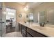 Bright bathroom features a double sink vanity and decorative art work adding character at 3825 Valleyway Rd, Cumming, GA 30040