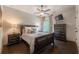 Bedroom featuring matching dark wood furniture set and a window for natural light at 3825 Valleyway Rd, Cumming, GA 30040