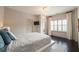 Bedroom featuring a bed with a white comforter, and white blinds and curtains on the window at 3825 Valleyway Rd, Cumming, GA 30040