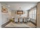 Elegant dining room with stylish lighting fixture, neutral paint, and a large wooden table at 3825 Valleyway Rd, Cumming, GA 30040