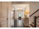Stunning foyer with chandelier, hardwood floors, staircase, and entryway table at 3825 Valleyway Rd, Cumming, GA 30040